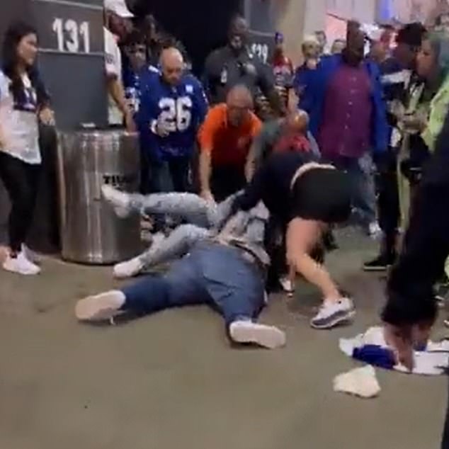 A Seahawks fan fought with a Giants fan on the ground before spectators and security intervened