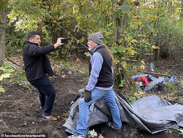 The driver (right) claimed he had permission to build the makeshift cabin in Beacon Hill