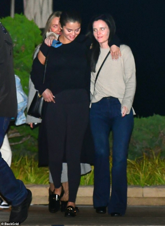 Time to go: Selena Gomez was pictured leaving Nobu in Malibu with a group of her friends on Friday night