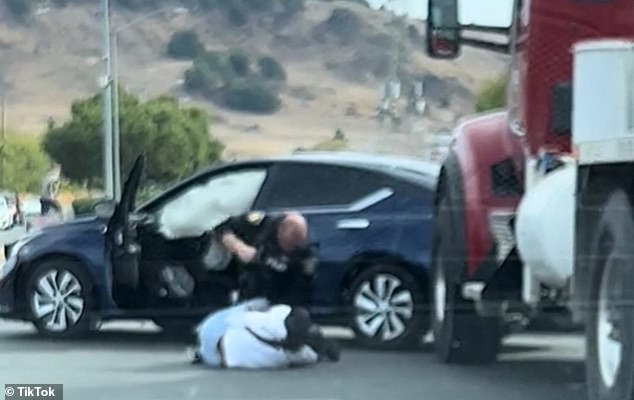 A video showing a California police officer dragging a woman from her car and slamming her to the ground after an alleged break-in has gone viral on social media