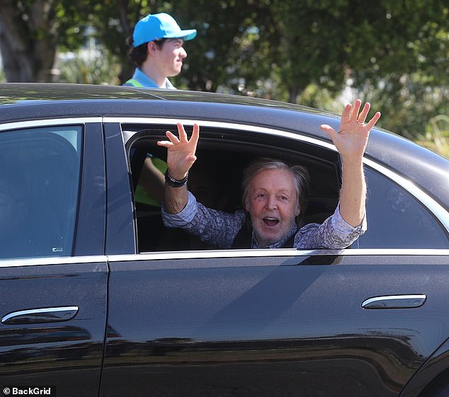 Loving life: Sir Paul McCartney was clearly in the mood for Twist and Shout as he greeted fans ahead of his first live performance in Newcastle, Australia on Monday