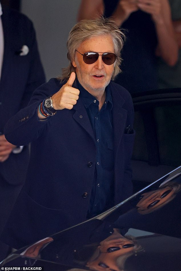 Sir Paul McCartney (pictured) was all smiles as he kissed fans goodbye as he left his Sydney hotel on Sunday after playing two sold-out concerts