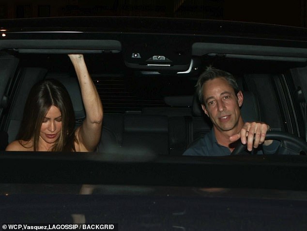 Cute: The hunky guy, who was clean-shaven and had charming dimples, drove to the party with Sofia in his passenger seat