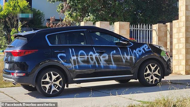 A Kia Sportage has been spray painted with some unkind words