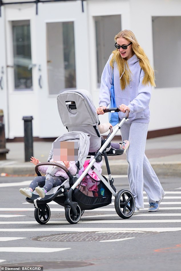 Sophie Turner looks overjoyed as she steps out in New York after reaching a deal with estranged husband Joe Jonas in their bitter custody battle