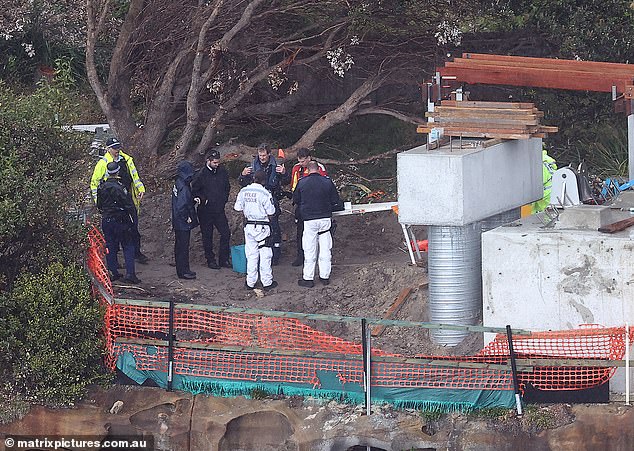 A man could be seen putting on a harness as officers prepared to winch him off the rocks