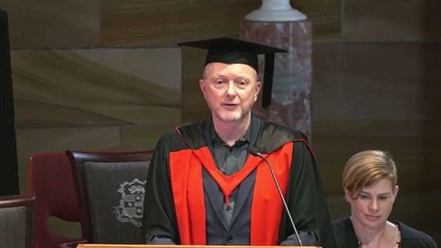 Professor Alan McKee (pictured centre) told graduating students that indigenous people would be traumatized and angry by the referendum result and would use their skills to help