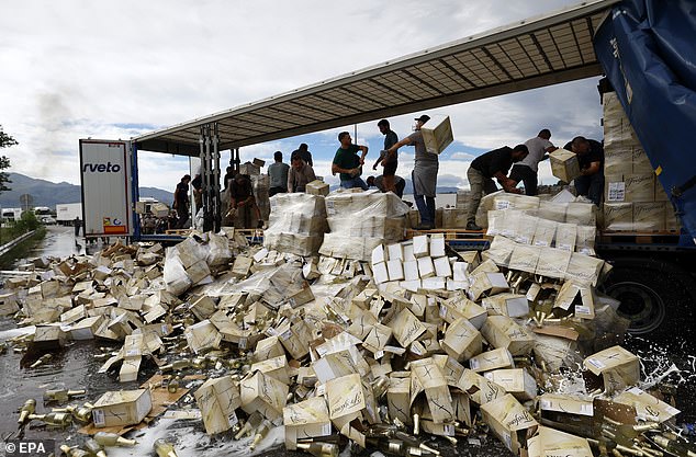 Protesters destroyed several wine shipments by smashing the bottles (photo) and pouring the wine onto the road