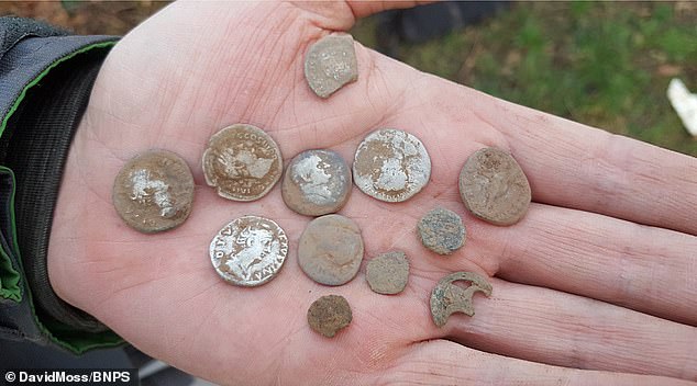 A pair of novice metal detectors have discovered a massive Roman hoard of 2,733 coins worth tens of thousands of pounds.