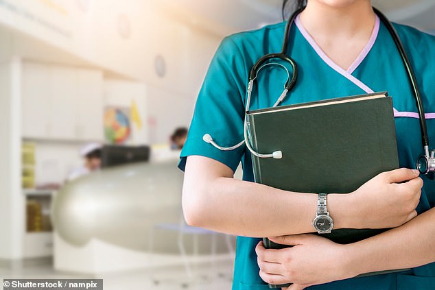 A junior nurse who had a threesome with two vulnerable female patients and gave them advice about self-harm has been banned for five years.  Pictured: File image of a nurse holding a diary