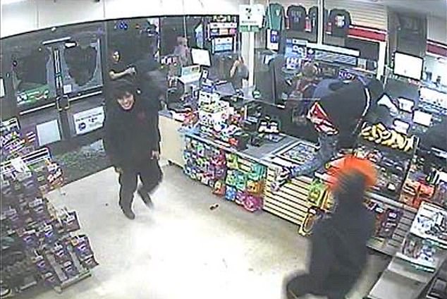 Surveillance footage shows a gang vandalizing and looting a California 7-Eleven.  A man wearing an orange and white Pennywise mask (bottom right) is seen entering and leaving the store several times