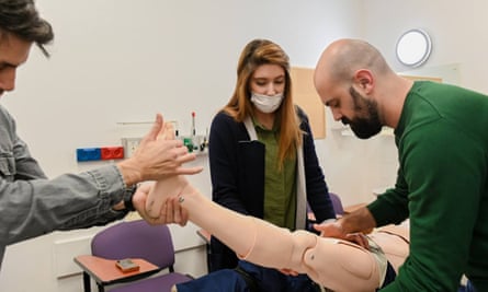 Medical staff train on a dummy