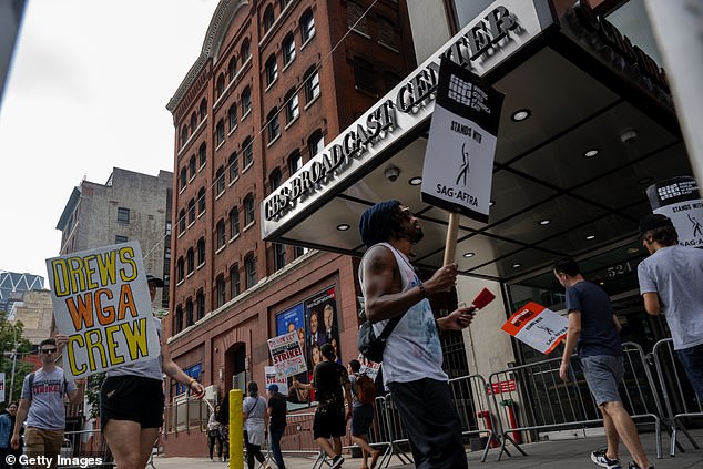 Strike line: WGA members picketed outside Barrymore's New York studios on September 12 after Barrymore took steps to resume the talk show during the strike