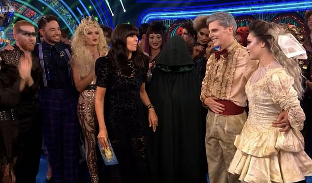 Hidden in Plain Sight: During the show, a figure wearing a traitor cloak was seen behind the presenter as she spoke to the couples as they received their scores from the judges