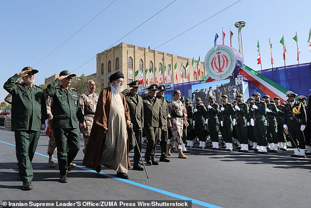 Iran's Supreme Leader Ayatollah Ali Khamenei (center) examines a group of armed forces cadets during their graduation ceremony in Tehran on Tuesday.  He used the opportunity to deny that Iran had any involvement in the Gaza attack on Israel