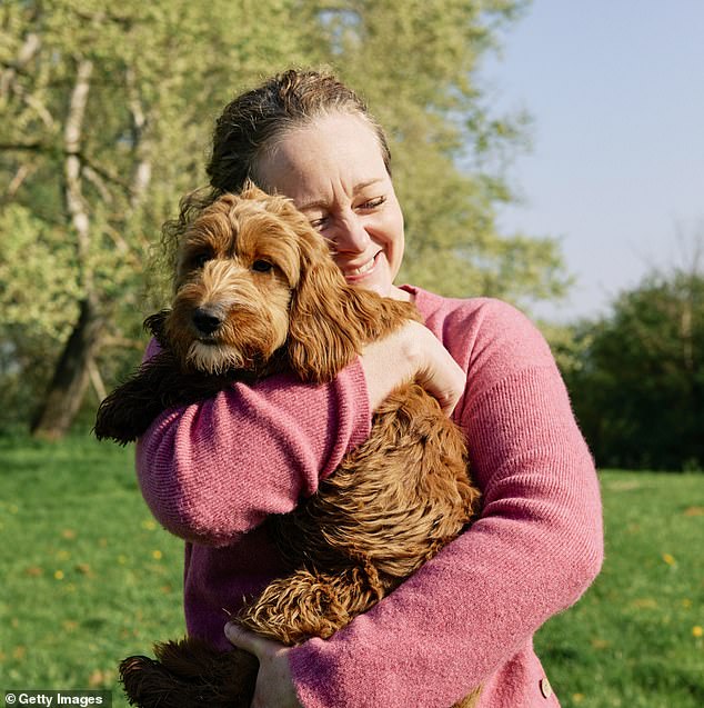 Much like people, pets also show their deep love when they receive physical touch, quality time, food and love (stock photo)