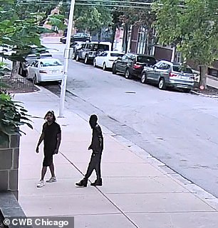 The video begins with the two attackers wandering through alleys in Chicago's Bucktown neighborhood