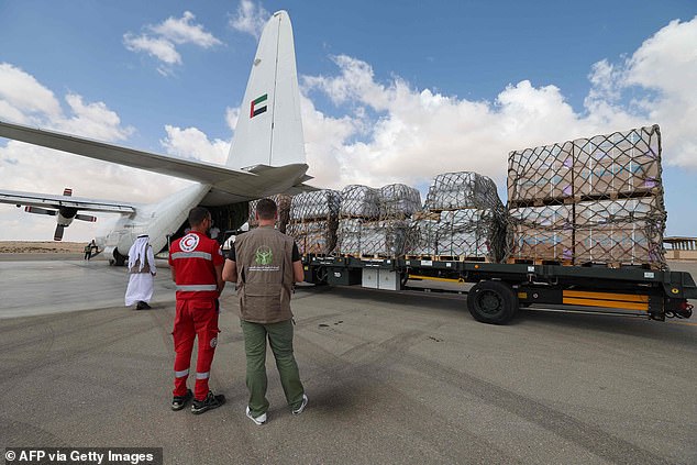 Aid for the Gaza Strip is unloaded Thursday from an Emirati cargo plane onto the tarmac of Egypt's el-Arish airport in the north of the Sinai Peninsula.  Thousands of tons of food, water and medicine are stuck on the Egyptian side of the border