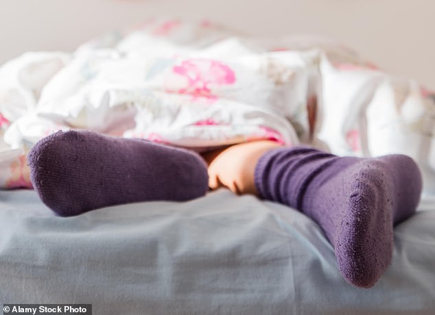 DR MARTIN SCURR: Tingling feet could be a sign of a back problem (stock image)