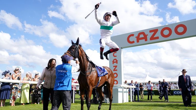 Frankie Dettori performs his famous flying dismount in Doncaster