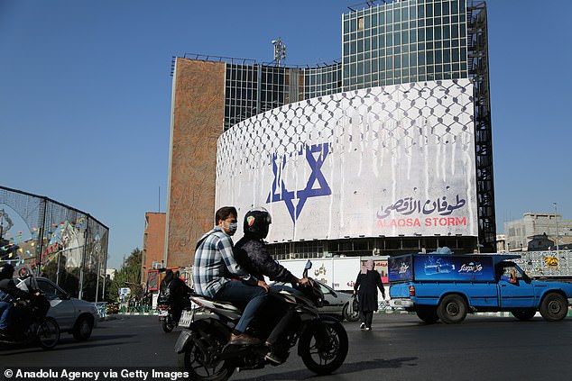 Anti-Israeli banners and billboards appeared in Tehran on Monday.  US officials say Iran was 'complicit' in Hamas attacks, but do not say Tehran is directly involved