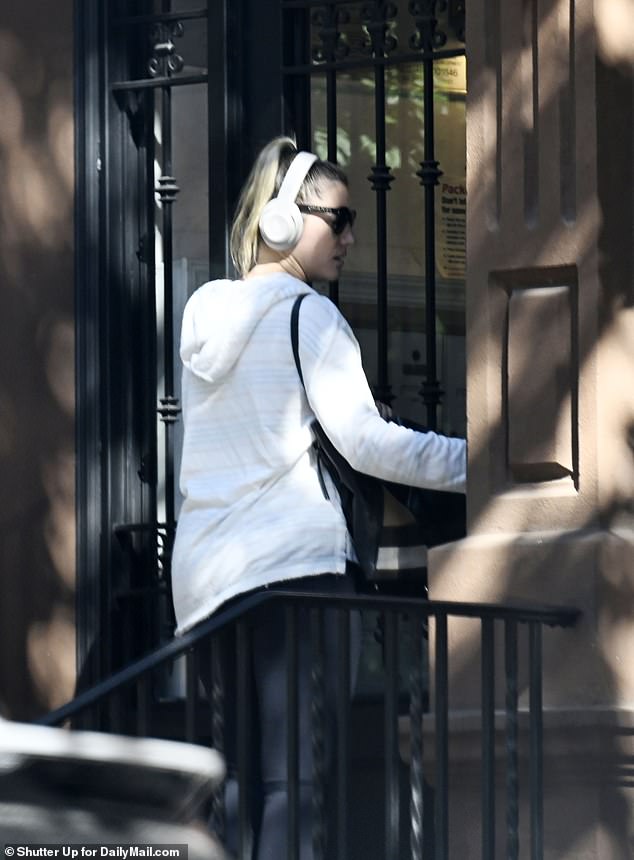 Pinnix was seen outside her Manhattan residence in a white hooded sweatshirt, sunglasses and Beats headphones