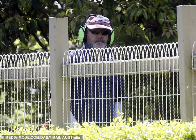 Marty Sheargold gardens at his $2.3 million estate in the Dandenong Ranges on the outskirts of Melbourne after taking 'personal leave'