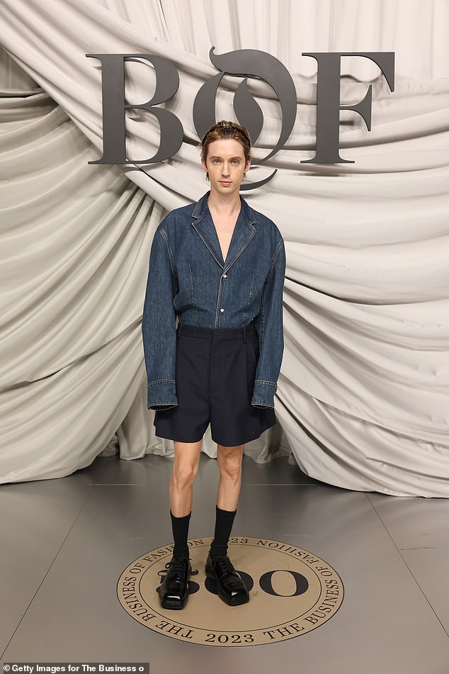 Troye Sivan, 28, (pictured) had guests doing a double take when he showed up at the Business of Fashion gala during Paris Fashion Week in France on Saturday in a truly unique outfit