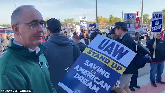 UAW President Shawn Fain addressed workers outside the plant and handed out signs