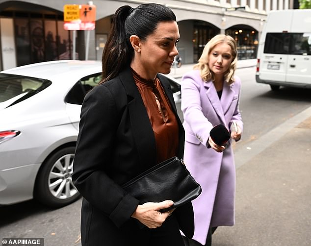 Vanessa Amorosi was greeted by the media outside a court in Melbourne on Friday