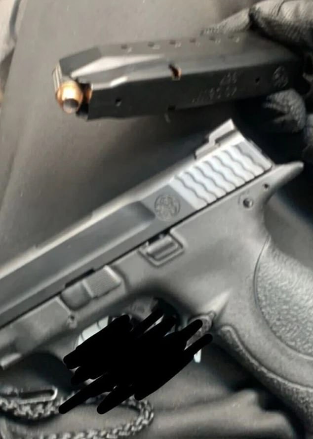 An image of a Smith & Wesson, and a hand holding a loaded magazine next to it (pictured), appeared after the break-in on an encrypted chat platform used by organized crime figures