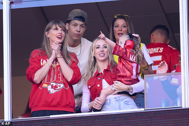 Taylor Swift (left) was joined at Arrowhead by social media influencer Jackson Mahomes (2L).