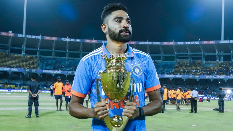 India's Mohammed Siraj poses with the trophy after India won the Asia Cup final cricket match between India and Sri Lanka in Colombo, Sri Lanka, Sunday, September 17, 2023. (AP Photo /Pankaj Nangia)