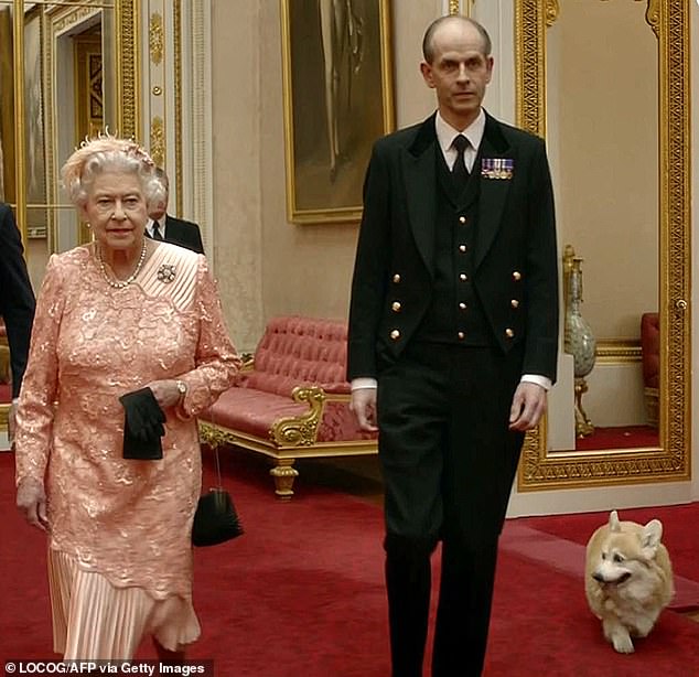 Earlier this year it emerged that King Charles had entrusted loyal Palace aide Paul Whybrew with the task of sorting through the Queen's private papers before they were transferred to the royal archives in Windsor.  Above: Whybrew with the Queen in the sketch filmed with James Bond star Daniel Craig in 2012