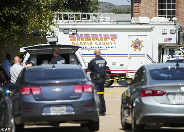 Officers with the Harris County Sheriff's Office respond to a shooting scene Sunday morning in Houston, Texas