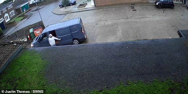 He then opens the van door before appearing to look around to see if anyone nearby is watching him