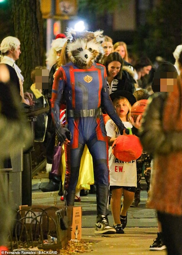 Actor Bradley Cooper and model Irina Shayk accompany their daughter Lea for a night of trick-or-treating on Halloween