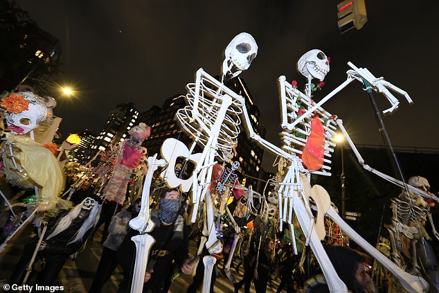 Huge towering skeletons are part of the raucous festivities