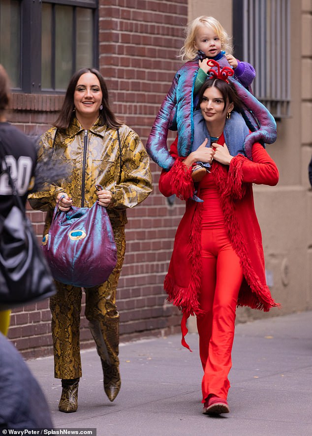 Bright outfit: The 32-year-old hands-on mom wore a playful monochrome red look