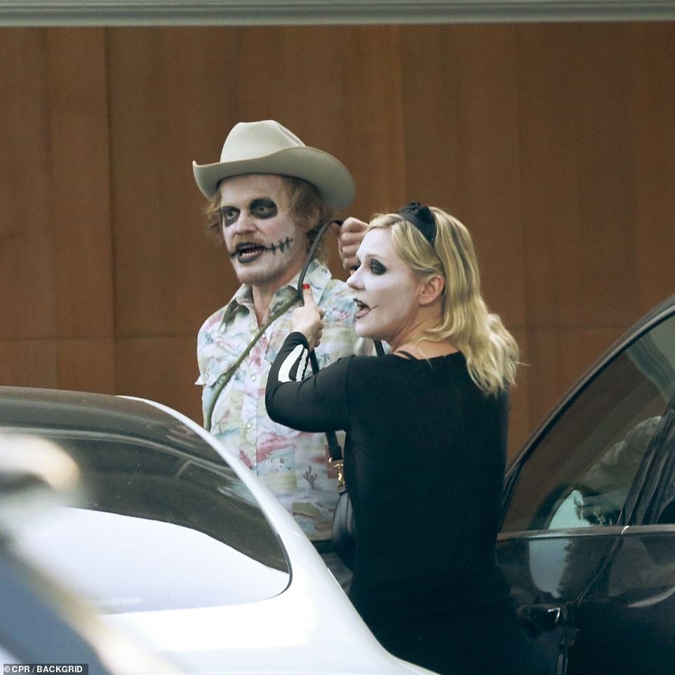 Supporting their kids: The Bring It On looked creepy yet chic as a skeleton as Plemons donned a cowboy zombie costume