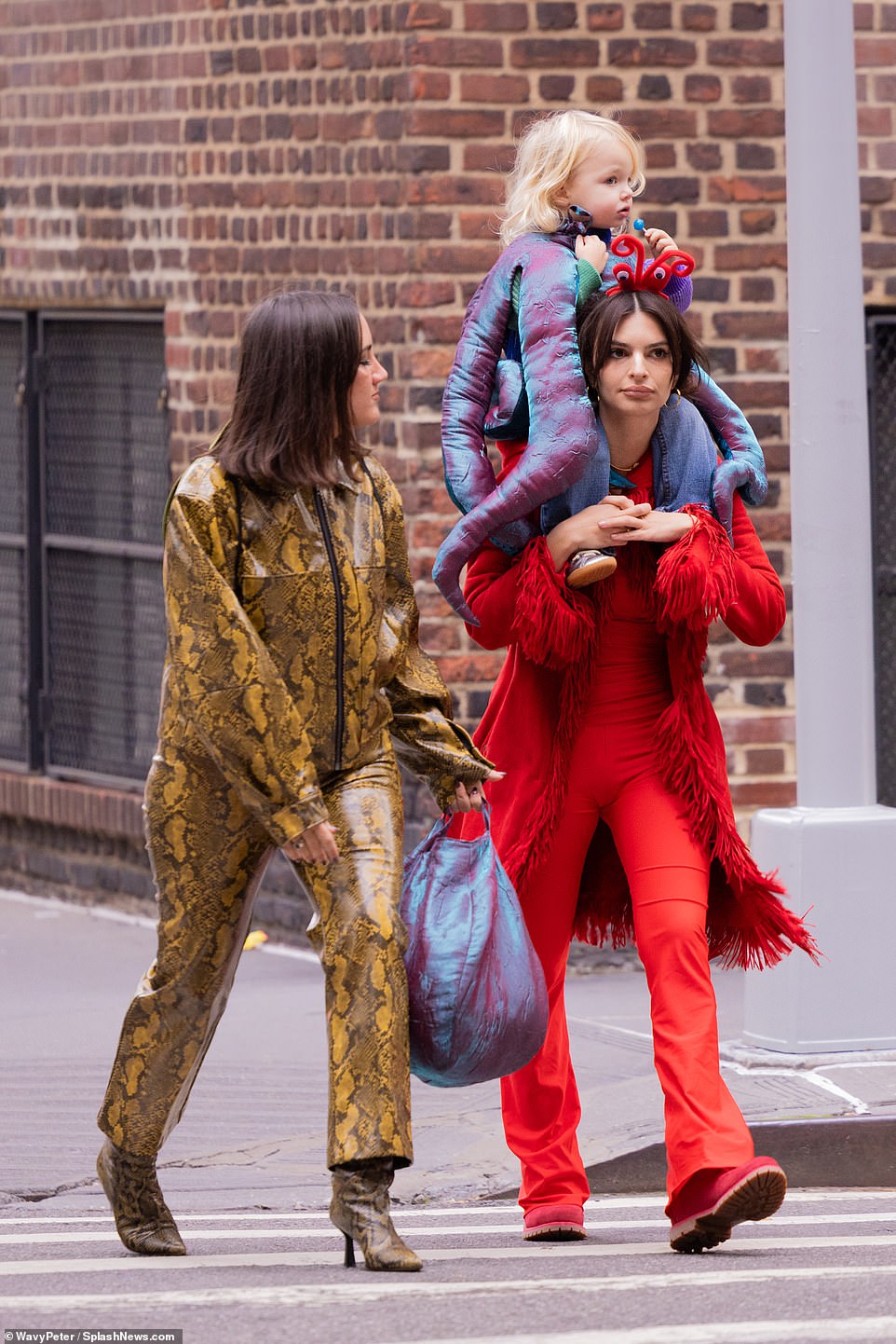 Motherhood: Across the country, Ratajkowski took her son Sylvester trick-or-treating in a playful monochrome red look