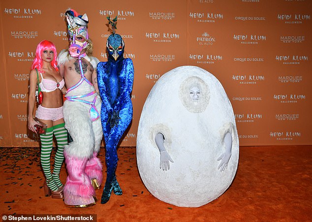 Egg: Her husband Tom Kaulitz wore an elaborate costume as a white peacock egg on the red carpet, while his brother Bill donned an elaborate white-pink furry outfit