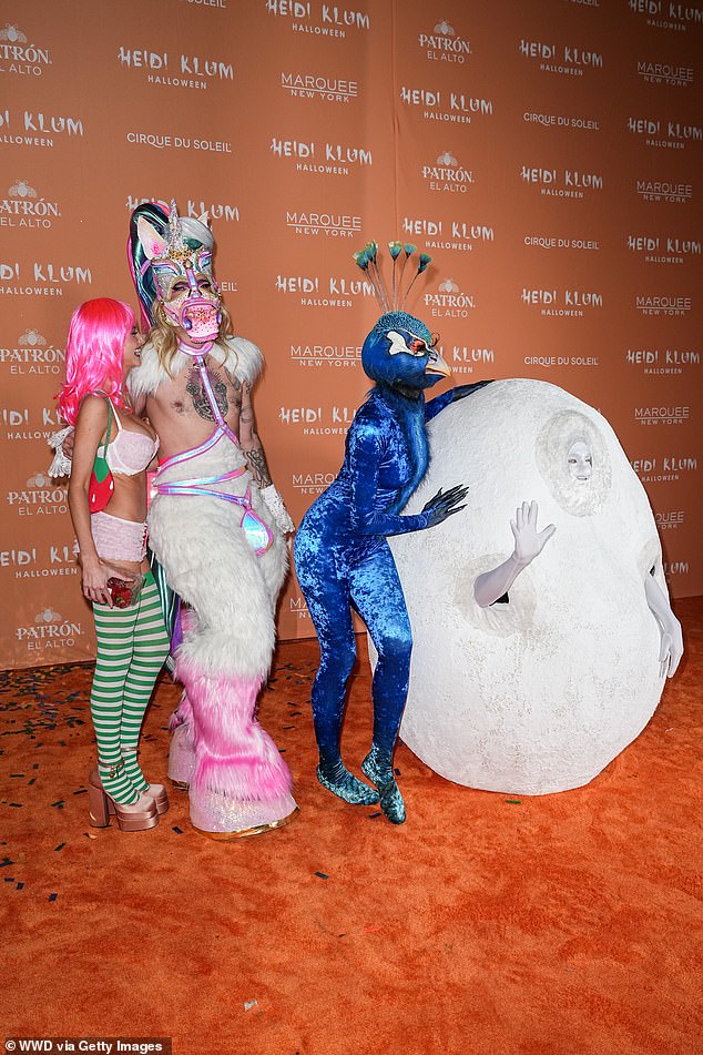 Peacock: Leni was joined on the red carpet by her mother Heidi, who this year was dressed as an elaborate blue peacock