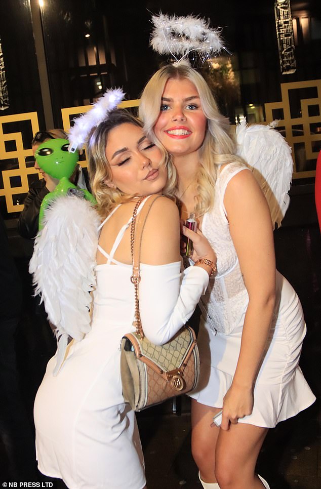 Two girls dressed as angels for a night out in Leeds