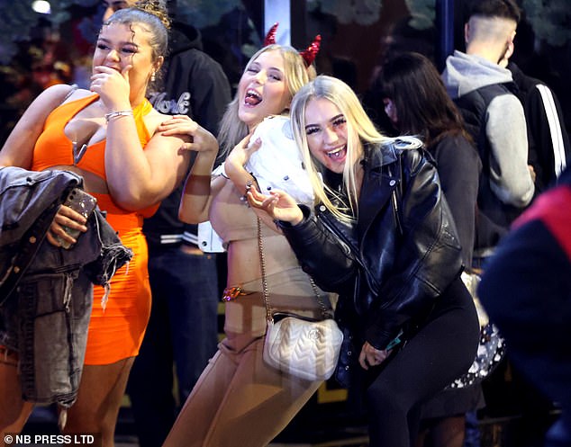 These girls looked to be having a great time on a night out in Leeds, with one wearing a pair of red devil horns