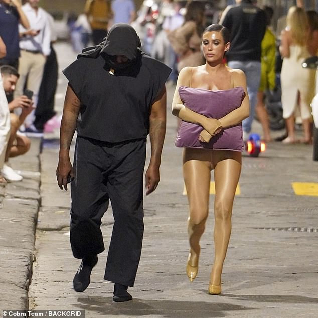 Memorable: Australian architect Bianca, 28, caused quite a stir in Italy last month by stepping out wearing only tight nude pants and a pillow to maintain her modesty