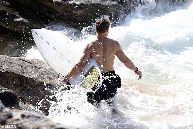 The father-of-two braved the choppy waters for an invigorating ride on the waves