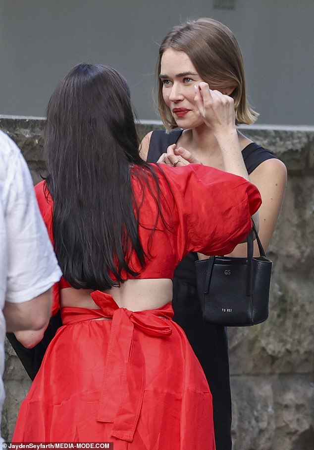 Before posing for photos, Gabriella watched a friend touch her face at the last minute