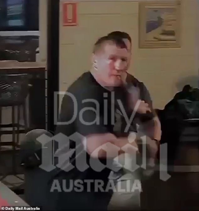 In one video, an employee is shown cleaning Gallen's face with a cloth.  When a man makes a cheeky comment elsewhere in the pub, Gallen runs to the voice (above)