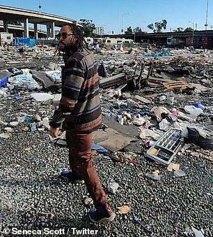 Scott walked around a local trash-filled lot to raise awareness of crime and drug issues in the area